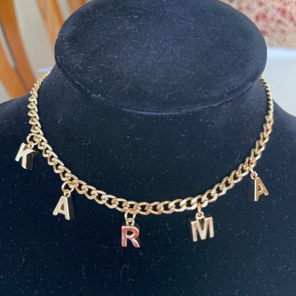 Urban Outfitters KARMA CHARM gold necklace